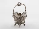 SKU IB08127: Victor Nuber Austrian sterling silver basket with ornate handle, four feet, and glass insert.