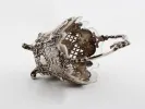 Victor Nuber sterling silver basket, SKU IB08127, with ornate pierced sides, four feet, handle, and glass insert.