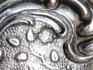 IB08127 Victor Nuber sterling silver basket, close-up of the ornate chiseled silver surface and hallmark.