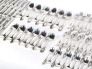 SKU IB08194: طقم أدوات مائدة روسي مطلي بالفضة بزخارف نباتية، يظهر ملاعق وشوك وسكاكين مرتبة على خلفية بيضاء.