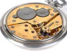 Omega watches pocket watch, SKU IB09263, showing the mechanical movement and guilloché back on a white background.