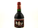 SKU IB09303: زجاجة Château Mouton Rothschild Pauillac 1994 نبيذ أحمر مع كبسولة حمراء وملصق مزخرف.