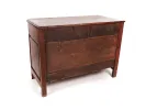 Back view of a wooden chest, plain surface, showing construction details and natural wood finish.