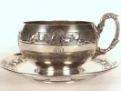 Leon Lapar sterling silver chocolate cup and saucer, SKU IB09600, with leaf garland decoration and ornate handle.