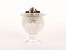 Lalique IB09723 crystal lighter holder with frosted lion head design and metal top, shown front view.